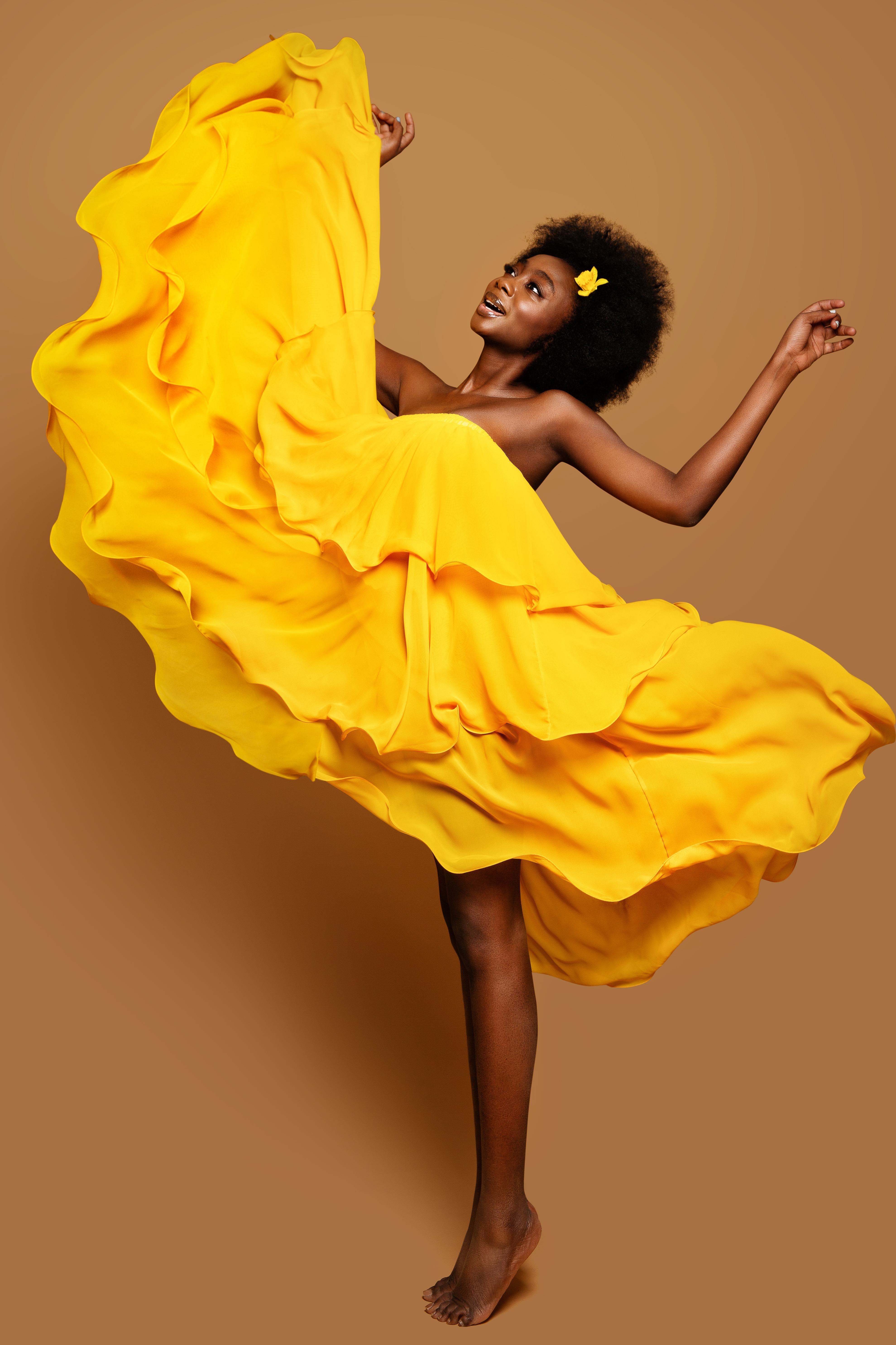 Woman dancing in Yellow Flying Dress